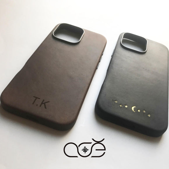 Two phone cases, one brown and one black