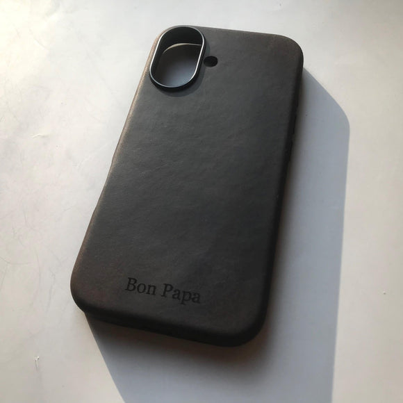 Black phone case with 'Bon Papa' branding on a light gray background
