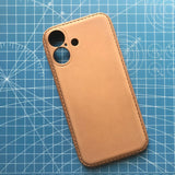 Brown leather phone case on a blue grid background