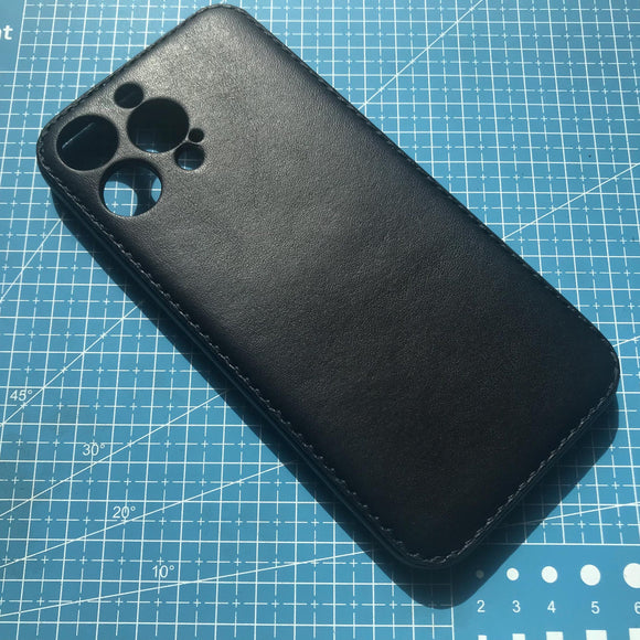 Black phone case on a blue cutting mat